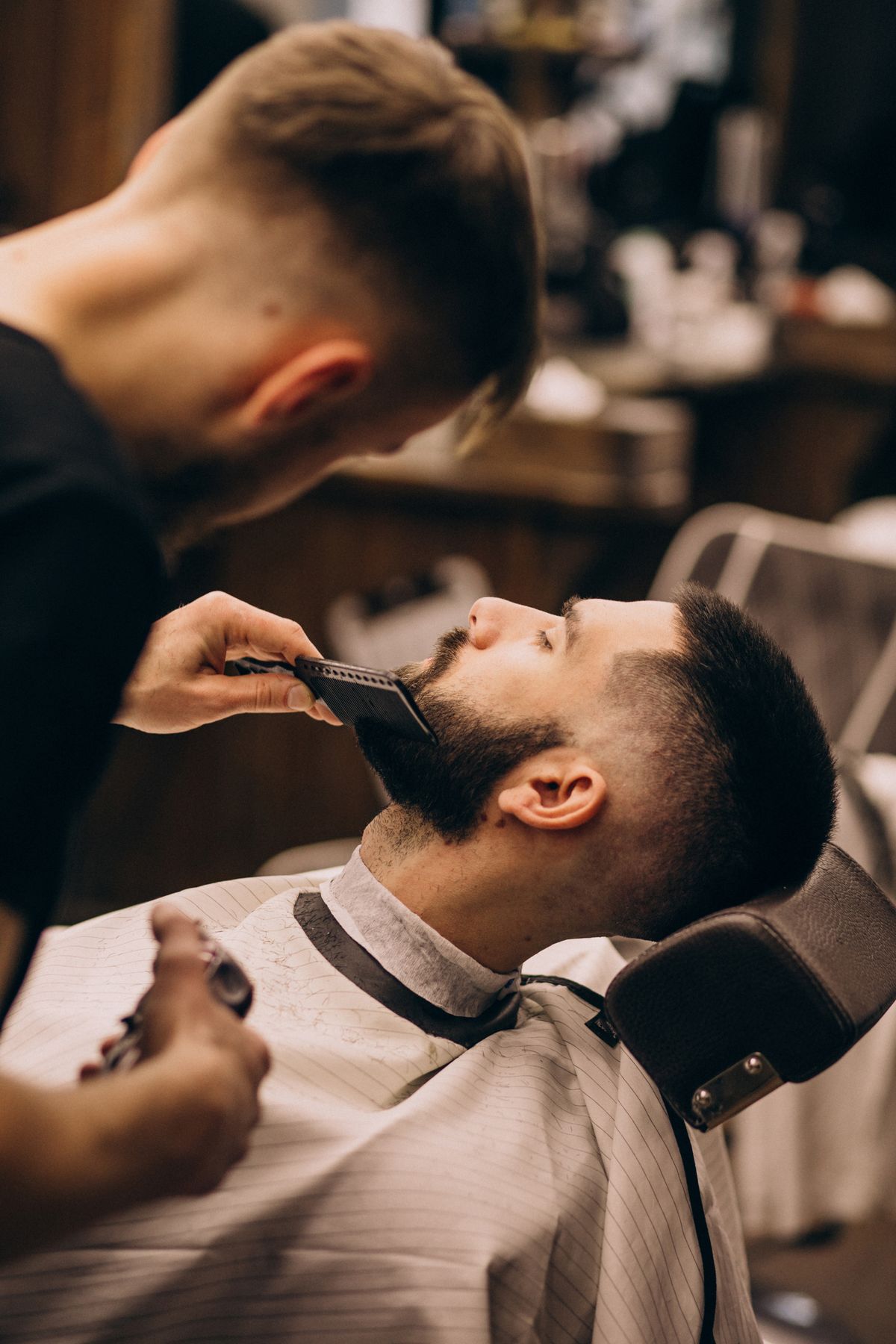 Barber detailing a beard